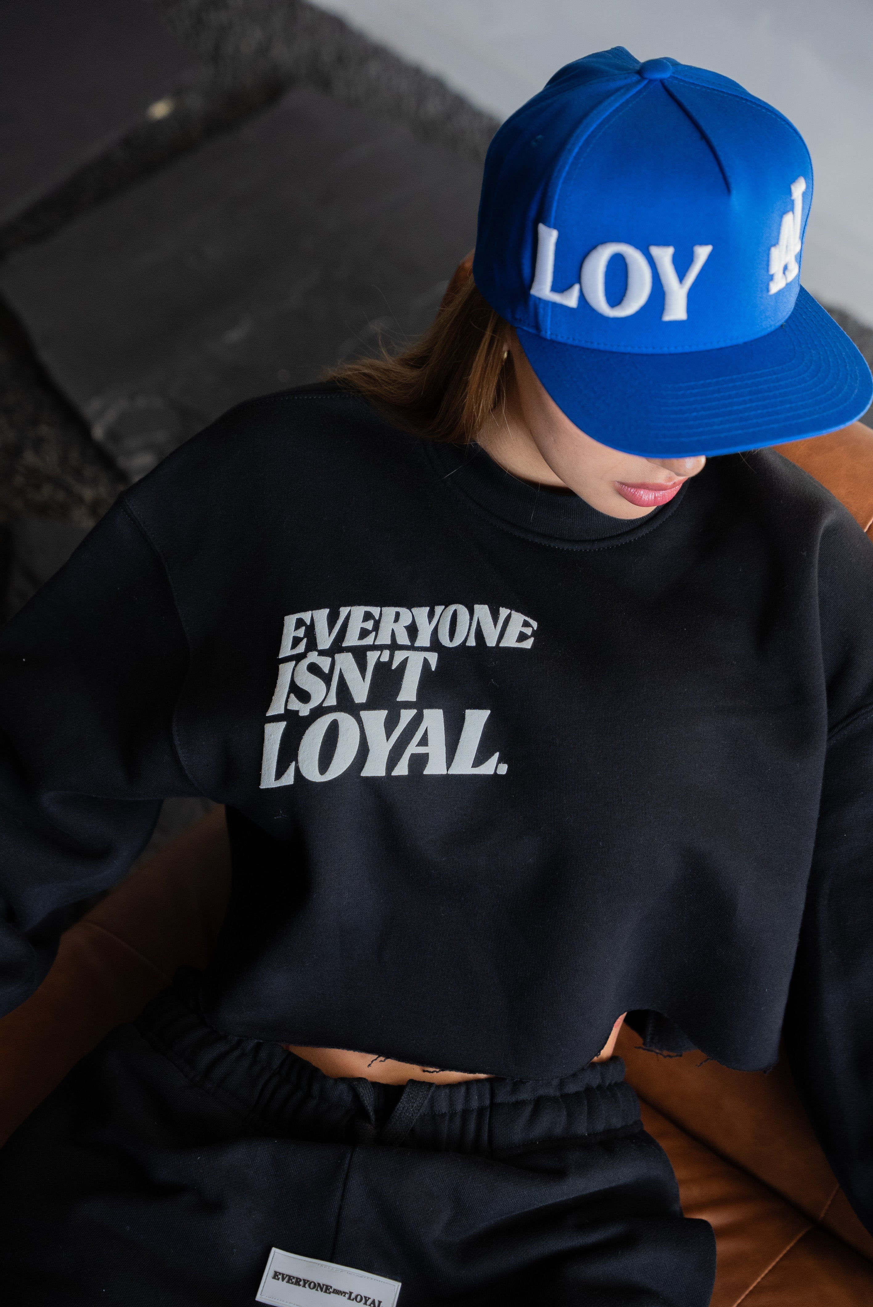 EVERYONE ISNT LOYAL SLANT CROP SWEATSHIRT