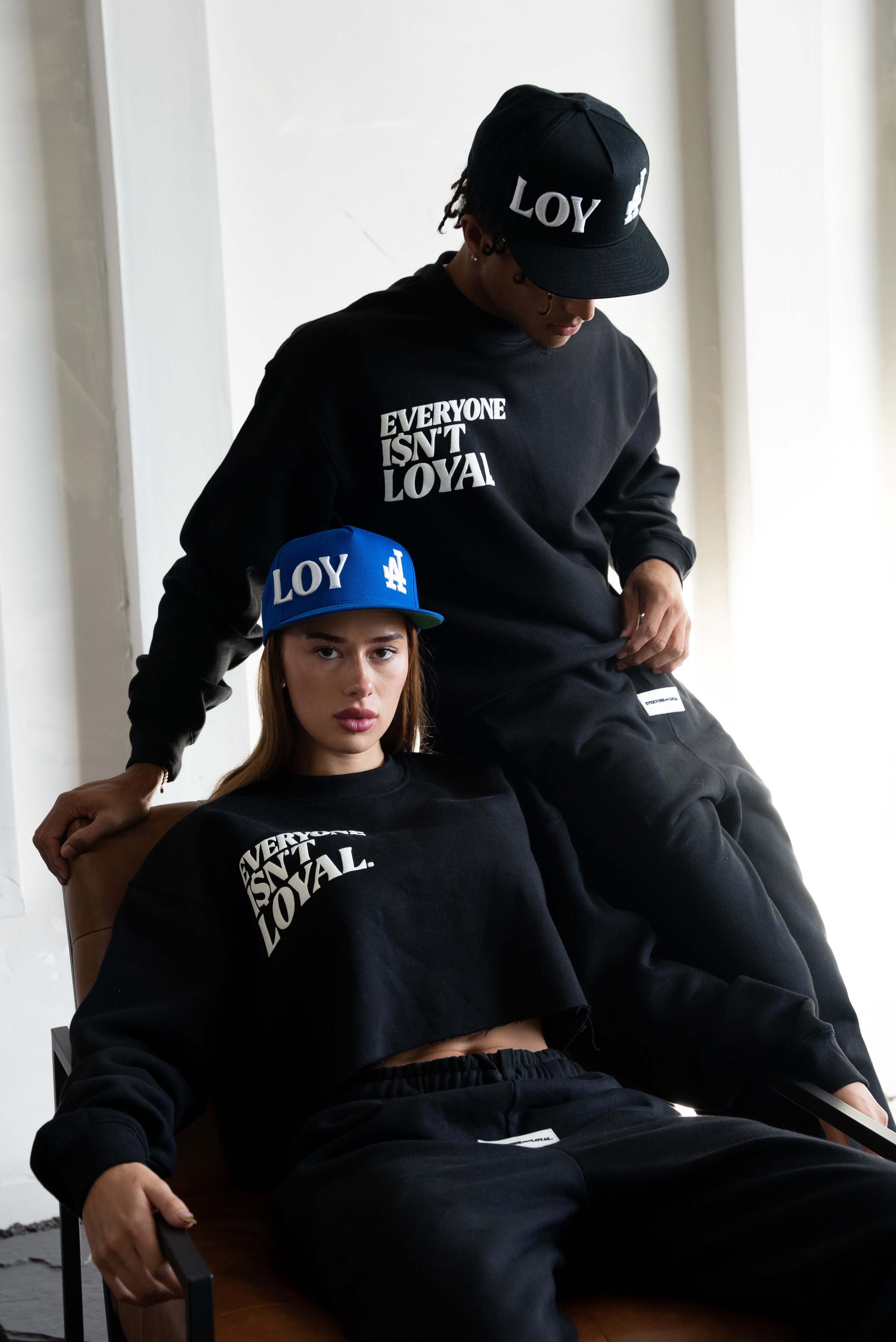 EVERYONE ISNT LOYAL SLANT CROP SWEATSHIRT