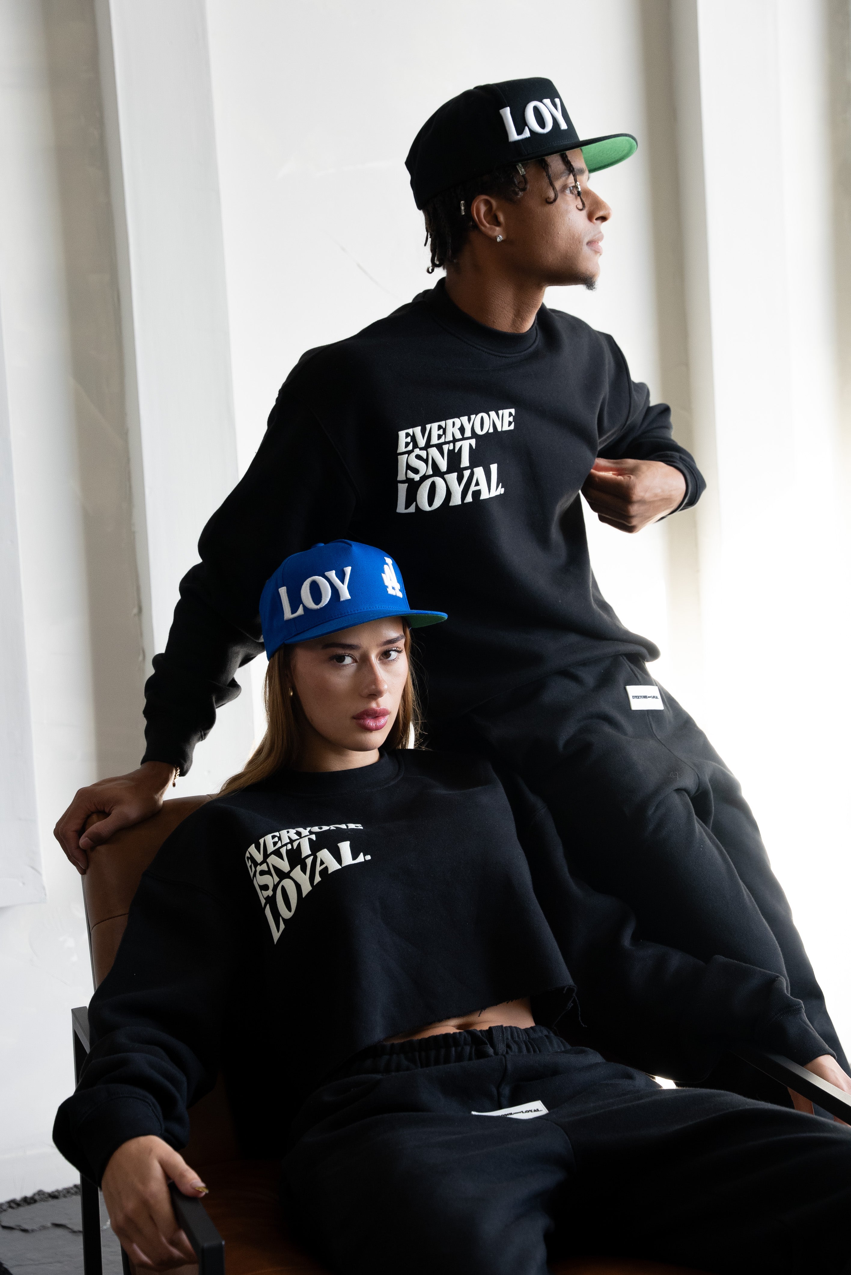 EVERYONE ISNT LOYAL SLANT CROP SWEATSHIRT